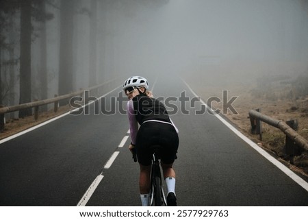 Similar – Image, Stock Photo Cyclist rides through image