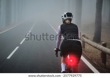 Similar – Image, Stock Photo Cyclist rides through image