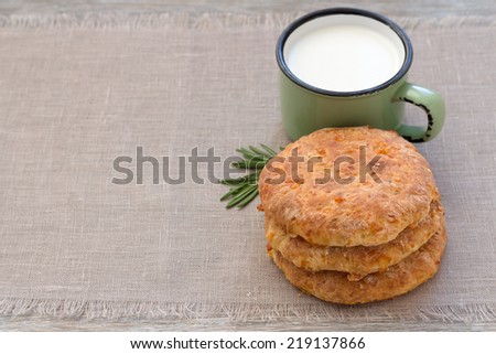Cheese flat bread with milk on textile napkin