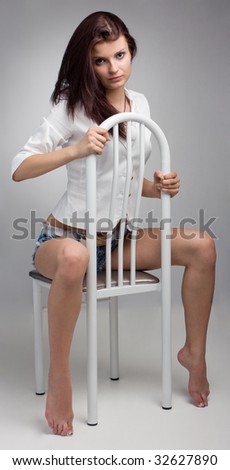 Young beautiful woman sit on chair