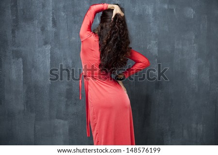 Portrait of back woman in red sexy dress