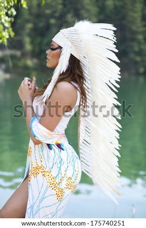 Young woman in costume of American Indian