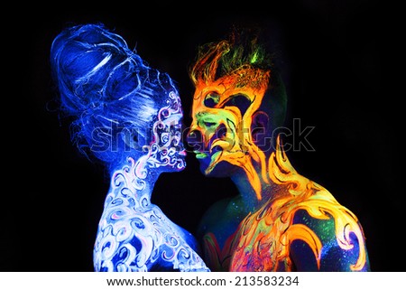 Body art glowing in ultraviolet light,  four elements, Air against Fire