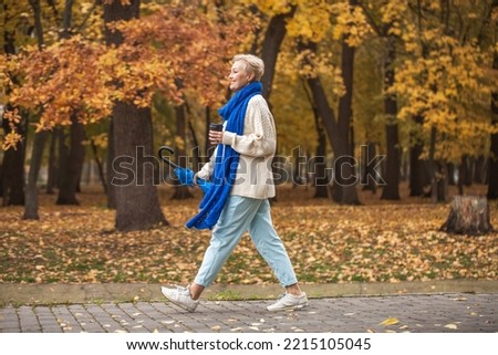 Similar – Image, Stock Photo Stylish woman in middle of city road