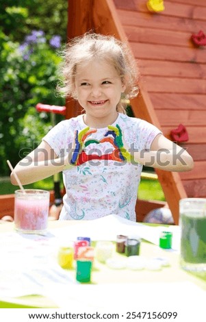 Similar – Image, Stock Photo Funny girl showing dirty hands