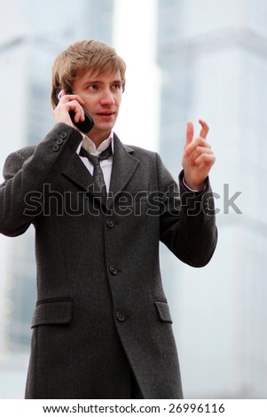 The man talks on a cellular telephone