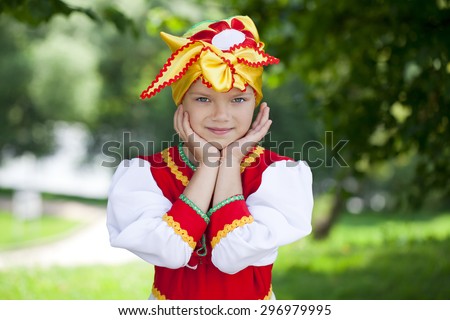Close up Little girl is dressed in the Russian national dress Ã??Ã?? summer park