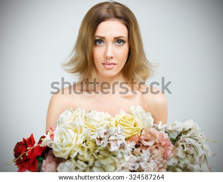 beauty girl with big bouquet of flowers. Beauty model Woman with Spring Flower bouquet.