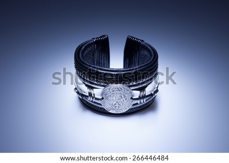 Leather bracelet with metal pendant