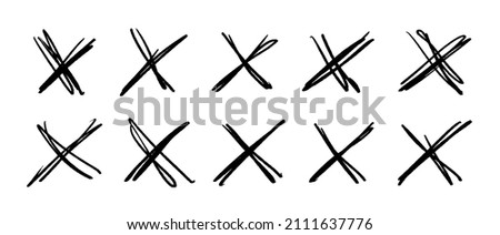 A set of scribble crosses to cross out or mark text. X sign in sketch style. Hand written doodle denial signs isolated on white background.