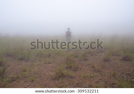 Alone man in fog