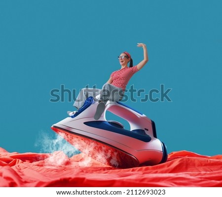 Tiny cheerful woman riding a iron and ironing clothes Stock foto © 