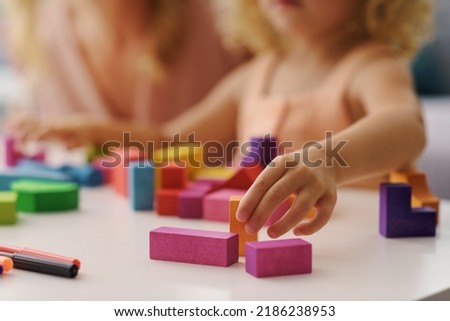 Similar – Image, Stock Photo Close up toddler hand on the table