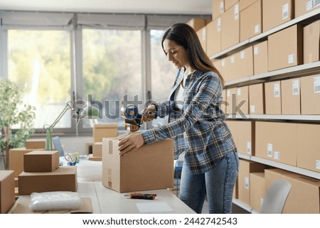 Similar – Image, Stock Photo Woman closing cardboard boxes with seal tape