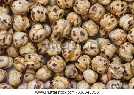 Roasted chickpea background. Roasted chickpea legume high protein snack texture.