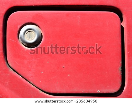 vintage gasoline tank on red car