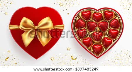 Box of wrapped chocolate sweets in heart shape. Red lid with golden bow. Top view vector illustration isolated. Realistic 3d design, romantic concept