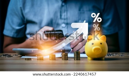 Interest rate and dividend concept, Businessman is calculating income and return on investment in percentage. income, return, retirement, compensation fund, investment, dividend tax, stock market Foto d'archivio © 