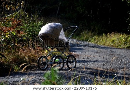 Similar – Image, Stock Photo Stroller in the rain with umbrella