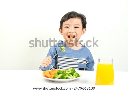 Similar – Image, Stock Photo Child eating fresh carrot