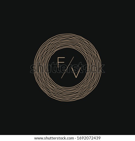 Graphic vector illustration of two letters F and V inside the tree rings