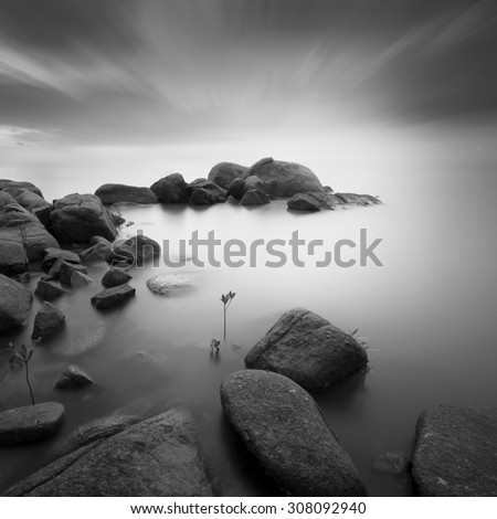 Long exposure black and white image of stone / rocks . Radial blur effect at sky