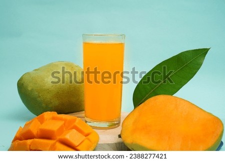 Mango drink on round tray with mango fruit on blue background Stok fotoğraf © 