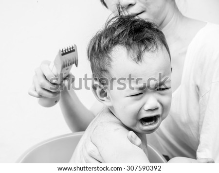 Fear, Thai baby feel scare of hair clipper when  mother cutting his hair
