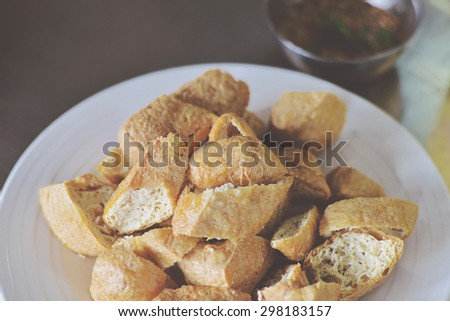 Fried Tofu. Popular Chinese snack. Toned image.