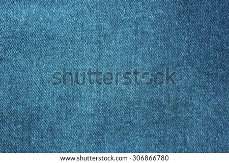 Blue jeans. Textured background. Toned image.