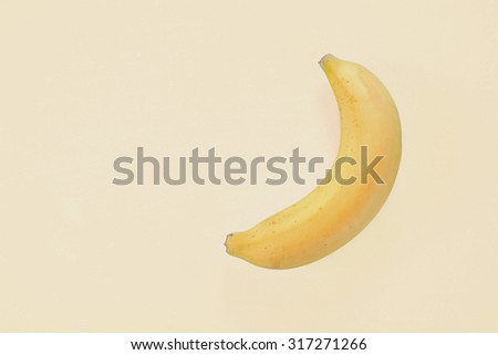 Fashion banana on yellow background. Vanilla style. Minimalism.