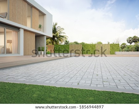 New house with empty cobblestone floor for car park. 3d rendering of green grass lawn in modern home.