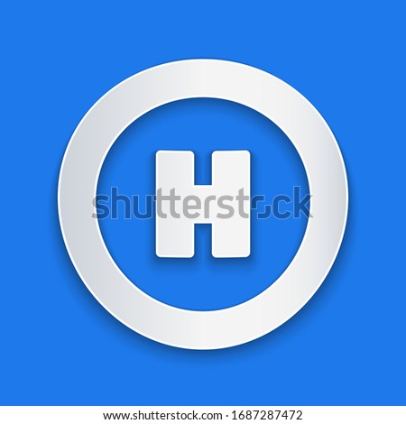 Paper cut Helicopter landing pad icon isolated on blue background. Helipad, area, platform, H letter. Paper art style. Vector Illustration