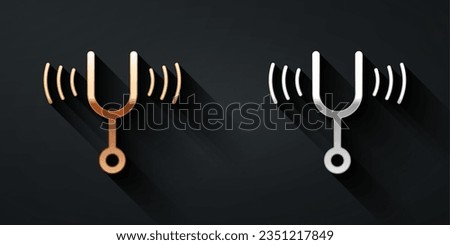 Gold and silver Musical tuning fork for tuning musical instruments icon isolated on black background. Long shadow style. Vector