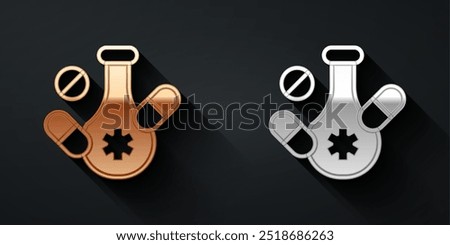 Gold and silver Medicine pill or tablet icon isolated on black background. Capsule pill and drug sign. Pharmacy design. Long shadow style. Vector