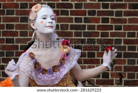 KRAKOW, POLAND - July 26, 2014: Woman mime in Krakow on Main Market, it is one of the tourist attractions of Main Market in Krakow, and a popular activity to make money.