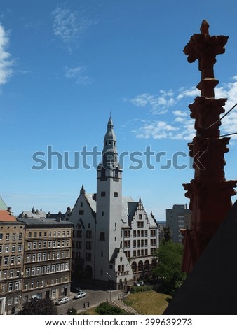 SZCZECIN, POLAND - June 5, 215: Building of Pomeranian Medical University - public medical college. In the foreground there is a fragment of decorating the building of the Red Town Hall