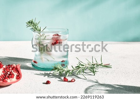 Similar – Image, Stock Photo Glass of pomegranate margarita with flower blooms near near feathers