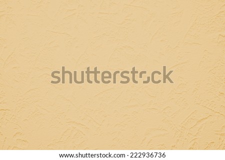 Wallpaper with light decorative texture for building repair decoration interiors. Orange peach cream color. Minimalism style