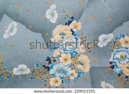 Chinese oriental silk cloth with floral pattern and big flowers. Grey blue and gold color