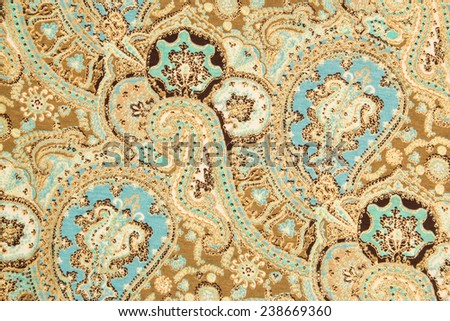 Oriental Indian cloth background with golden floral pattern