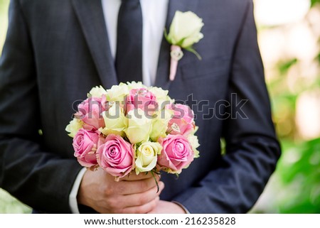 bride bouquet groom wedding rings hands