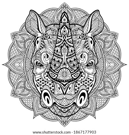 Rhino. Rhinoceros. Ornamental Animal head. Hand drawn of rhino head in zentangle style. The head of a Rhinoceros is drawn by hand with ink, with ethnic patterns.  Coloring antistress.