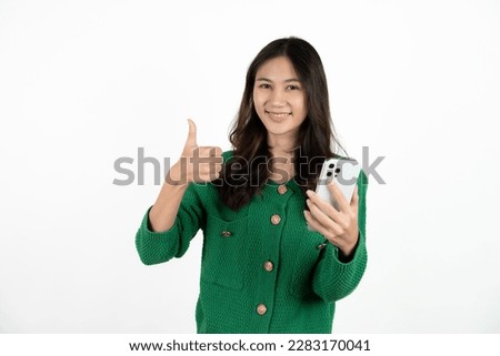 Similar – Image, Stock Photo Happy Asian woman browsing smartphone near car