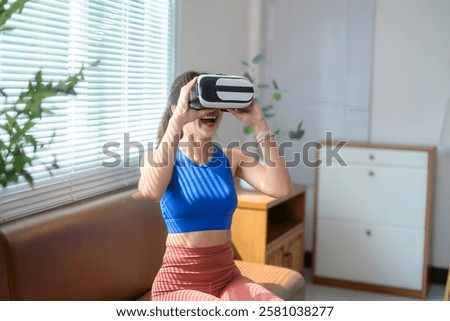 Image, Stock Photo Sportswoman in headset using social media on smartphone after workout