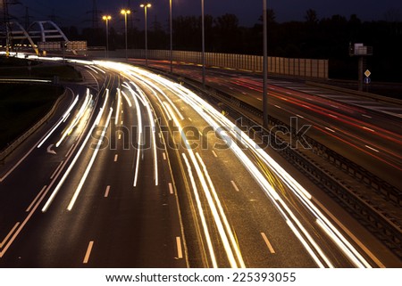 Long time exposure night scene of highway with long car lights trails in Saint-Petersburg, Russia.