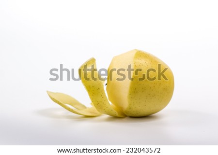 twisted peel of yellow apple on white background