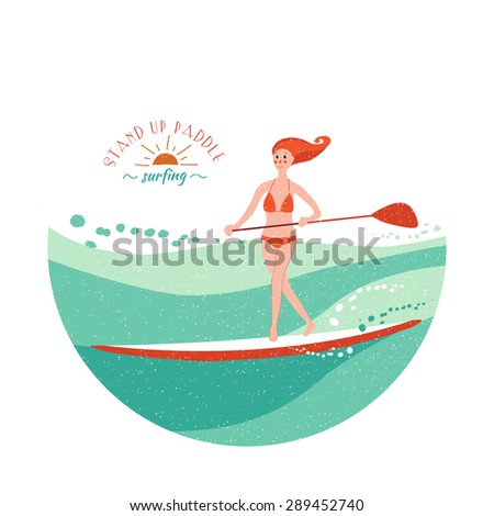 Stand Up Paddle Surfing. Young girl rides on the board making little steps. Green waves.