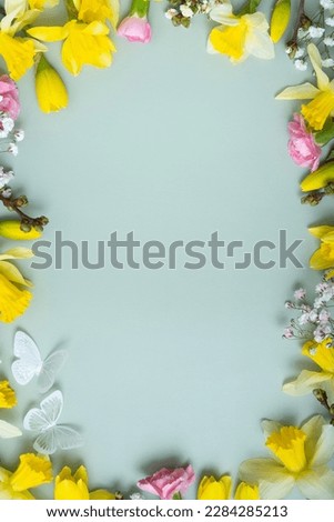 Similar – Image, Stock Photo blooming yellow daffodil bud on a blue background, spring flower