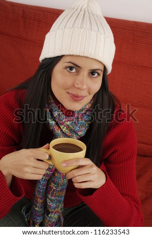 Beautiful young woman drinking a cup of tea.Woman cup
